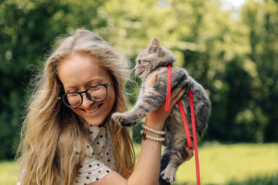 Portrait of smiling young woman with dog