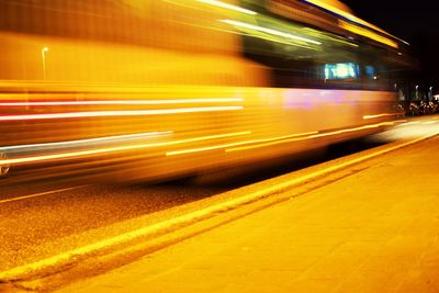 Blurred motion of train at railroad station at night