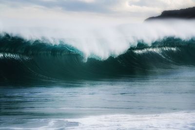 Waves splashing and curling in sea