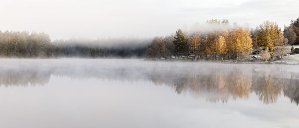 Scenic view of lake against sky during autumn