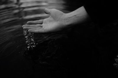 Close-up of hand holding water