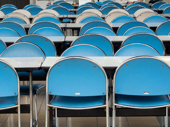 Empty tables and chairs arranged at outdoor restaurant