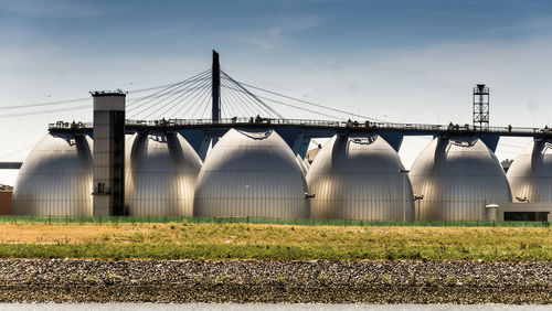 Low angle view of factory against sky