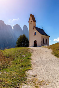 Exterior of building by mountains against sky