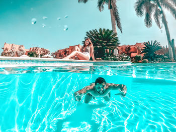 High angle view of woman swimming in pool