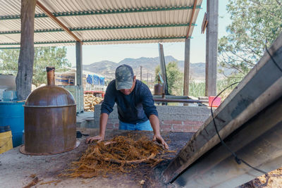 Rear view of man working at construction site