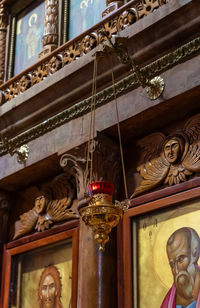 Low angle view of statue against illuminated building