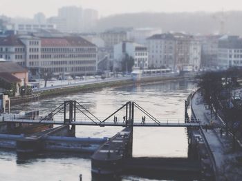 View of bridge over river in city