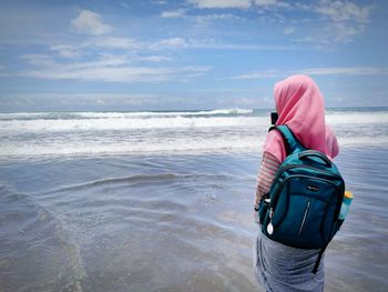 Rear view of woman on beach