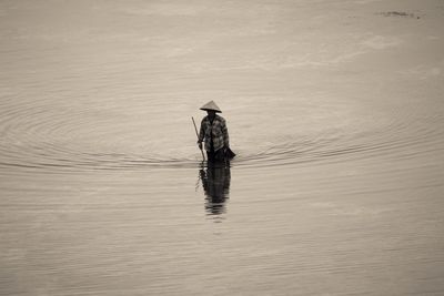 Full length of man fishing in water