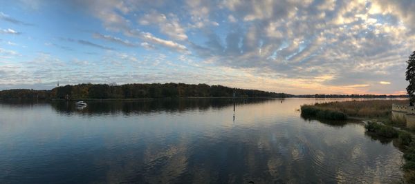 Scenic view of lake against sky during sunset