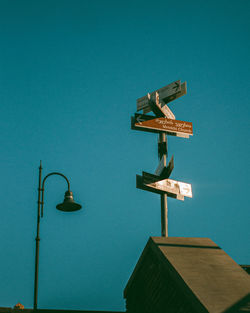 Low angle view of street light against clear blue sky