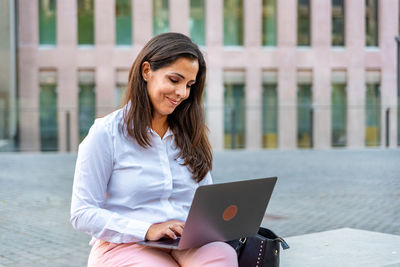 Young woman using mobile phone