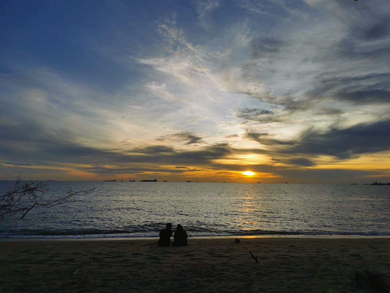 sky, water, sea, beach, horizon, cloud, sunset, land, ocean, beauty in nature, scenics - nature, nature, sunlight, shore, horizon over water, sun, dusk, tranquility, body of water, coast, tranquil scene, evening, wave, sand, holiday, afterglow, two people, vacation, trip, silhouette, outdoors, leisure activity, men, idyllic, travel destinations, togetherness, wind wave, reflection, travel, adult, seascape, lifestyles, relaxation