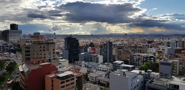 High angle view of buildings in city against sky