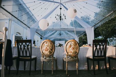 Empty chairs and tables in restaurant