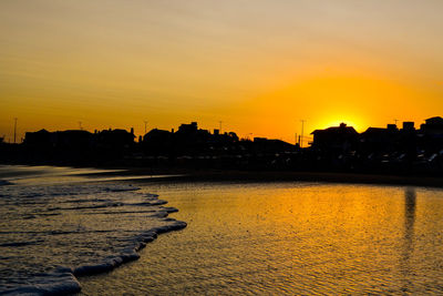 Scenic view of sea against romantic sky at sunset