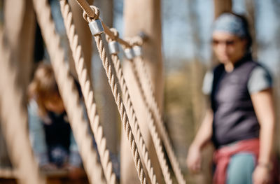 Midsection of woman with rope