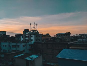 Cityscape against sky during sunset