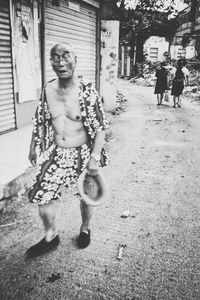 Full length of woman standing by railing