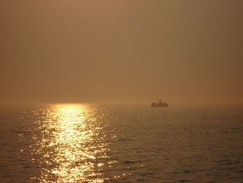 Scenic view of sea against sky during sunrise