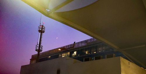 Low angle view of illuminated building against sky