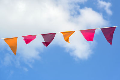 Low angle view of flag against sky