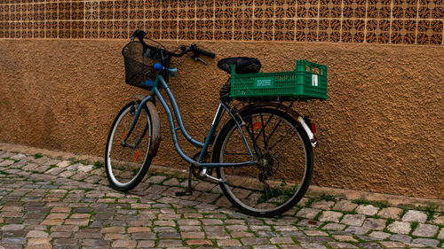 Bicycle parked against wall