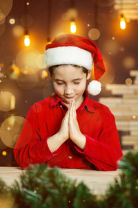 Funny child in santa red hat. portrait of lovely boy. merry christmas