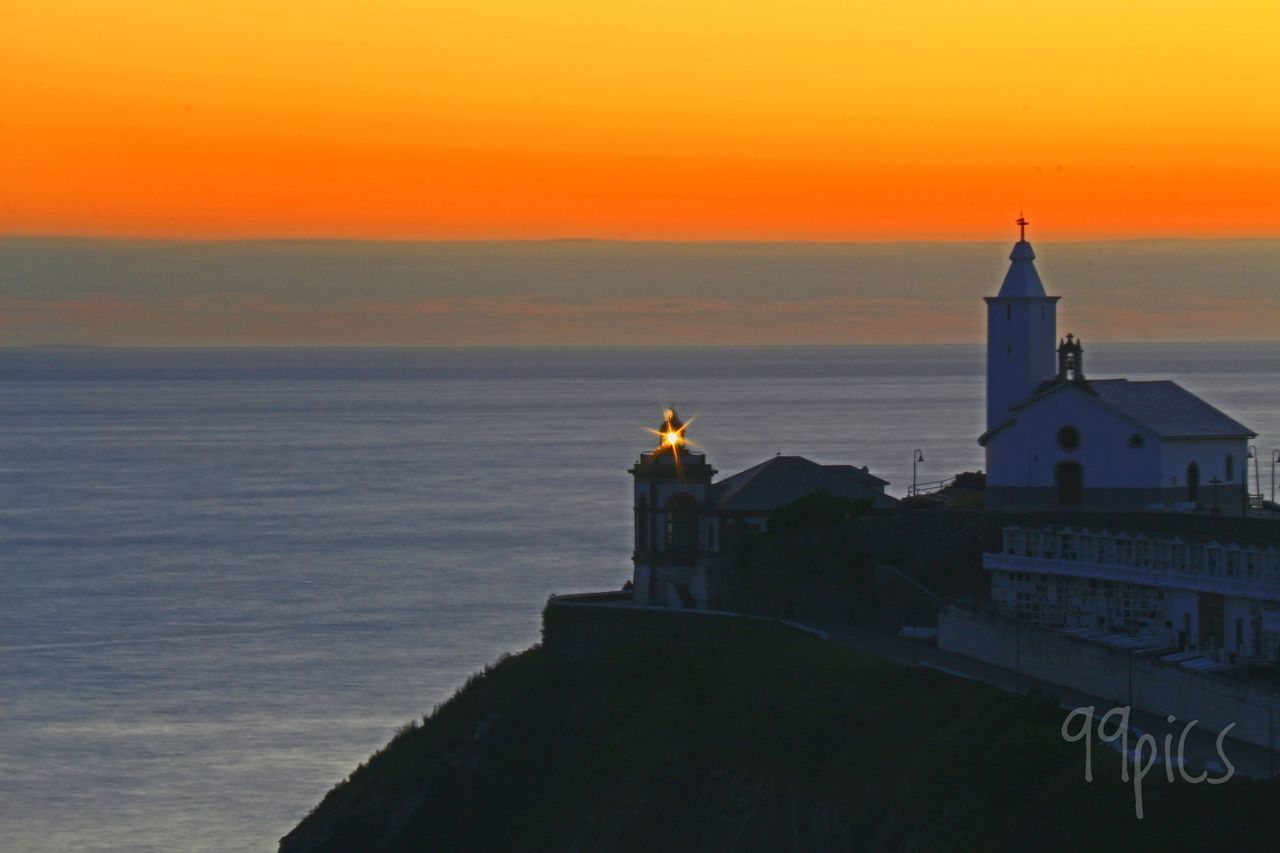 VIEW OF STATUE AT SUNSET