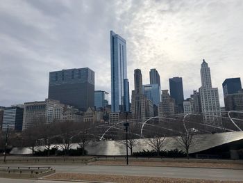 Modern buildings in city against sky