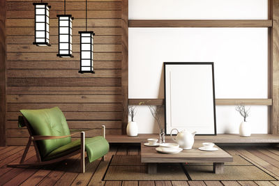 Empty chairs and table against wall at home