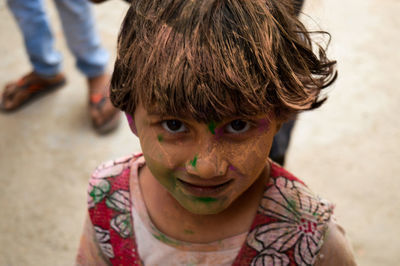 Close-up portrait of girl with messy face