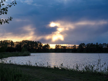Scenic view of lake against sky during sunset