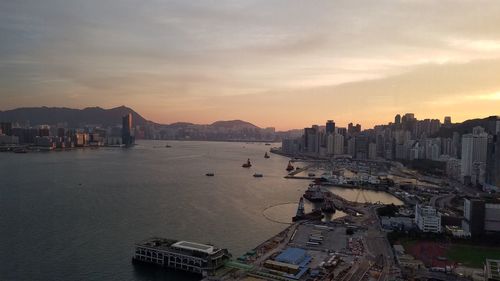 High angle view of bay and buildings against sky