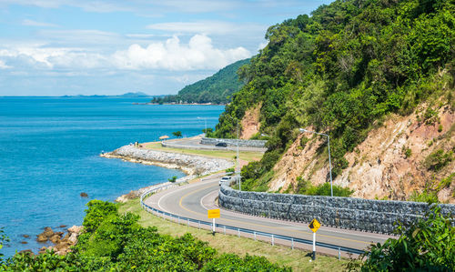 High angle view of road by sea against sky