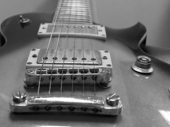 Close-up of guitar on table