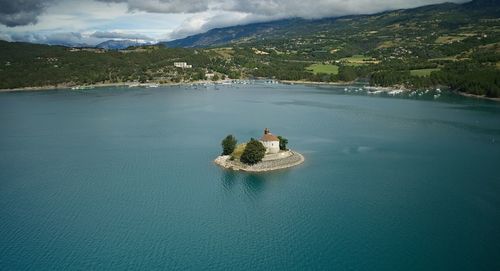 High angle view of swimming pool in lake against sky