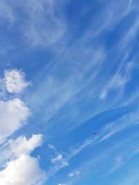 Low angle view of airplane flying in sky