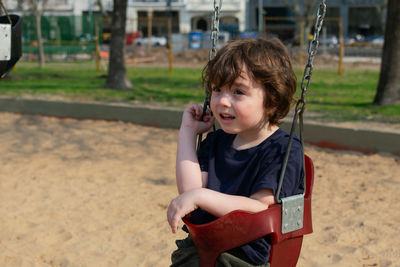 Portrait of boy playing on playground