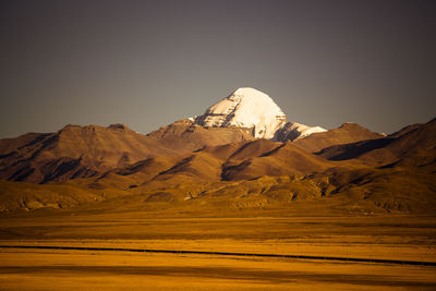 Scenic view of snowcapped mountains against clear sky