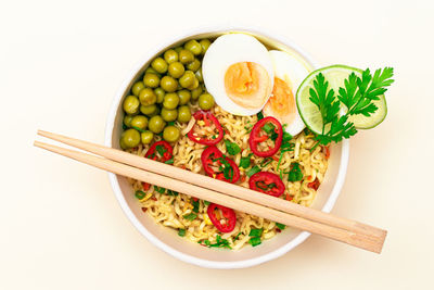 High angle view of food in bowl on white background