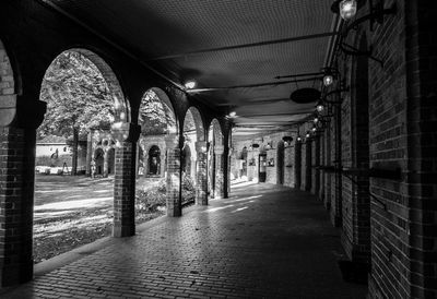 Empty alley amidst buildings in city