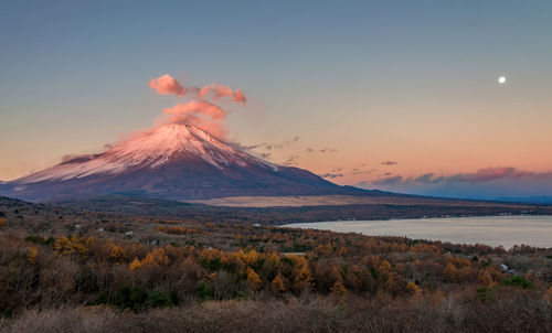 View of volcanic landscape against sky during sunset