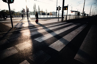 People crossing road in city