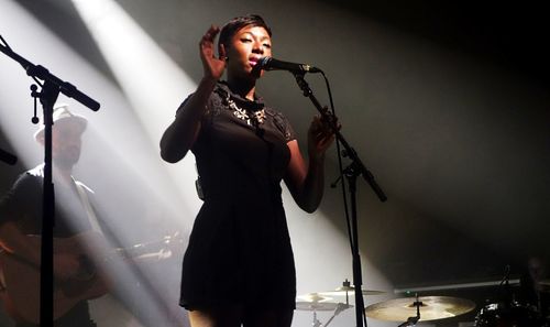 Full length of senior woman standing on stage