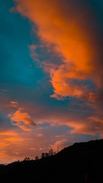 Low angle view of dramatic sky during sunset