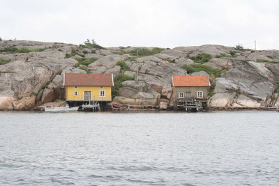 Scenic view of sea and mountains against sky