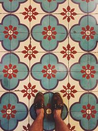 Low section of people on tiled floor