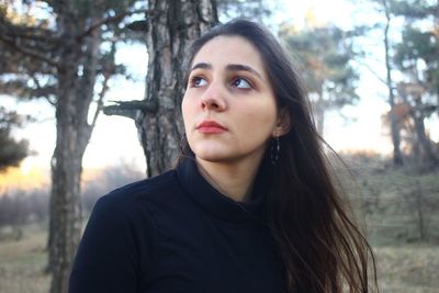 Portrait of young woman in forest